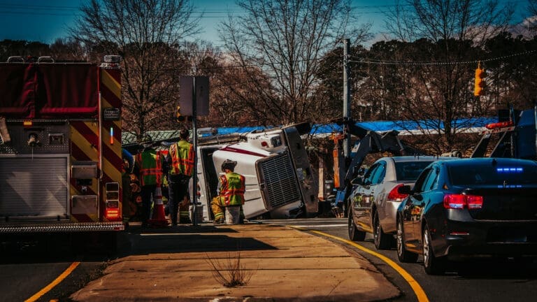 Large Hauling Truck overturned in accident on highway - call truck Accident Lawyers Group to see if we can help you