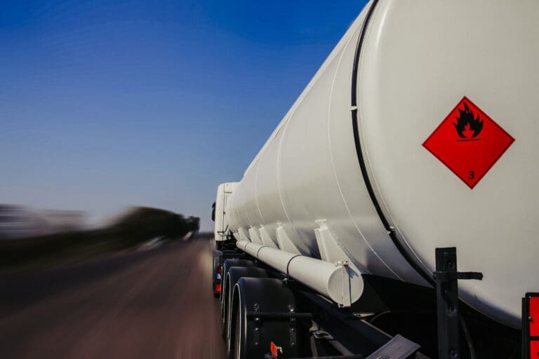 Tanker lorry or truck on a motorway with class 3 flammable placard